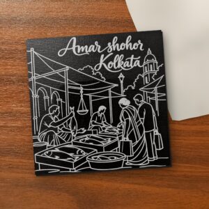 Amar Shohor Kolkata - Fish Market 5x5 inch black engraved art canvas on a wooden table