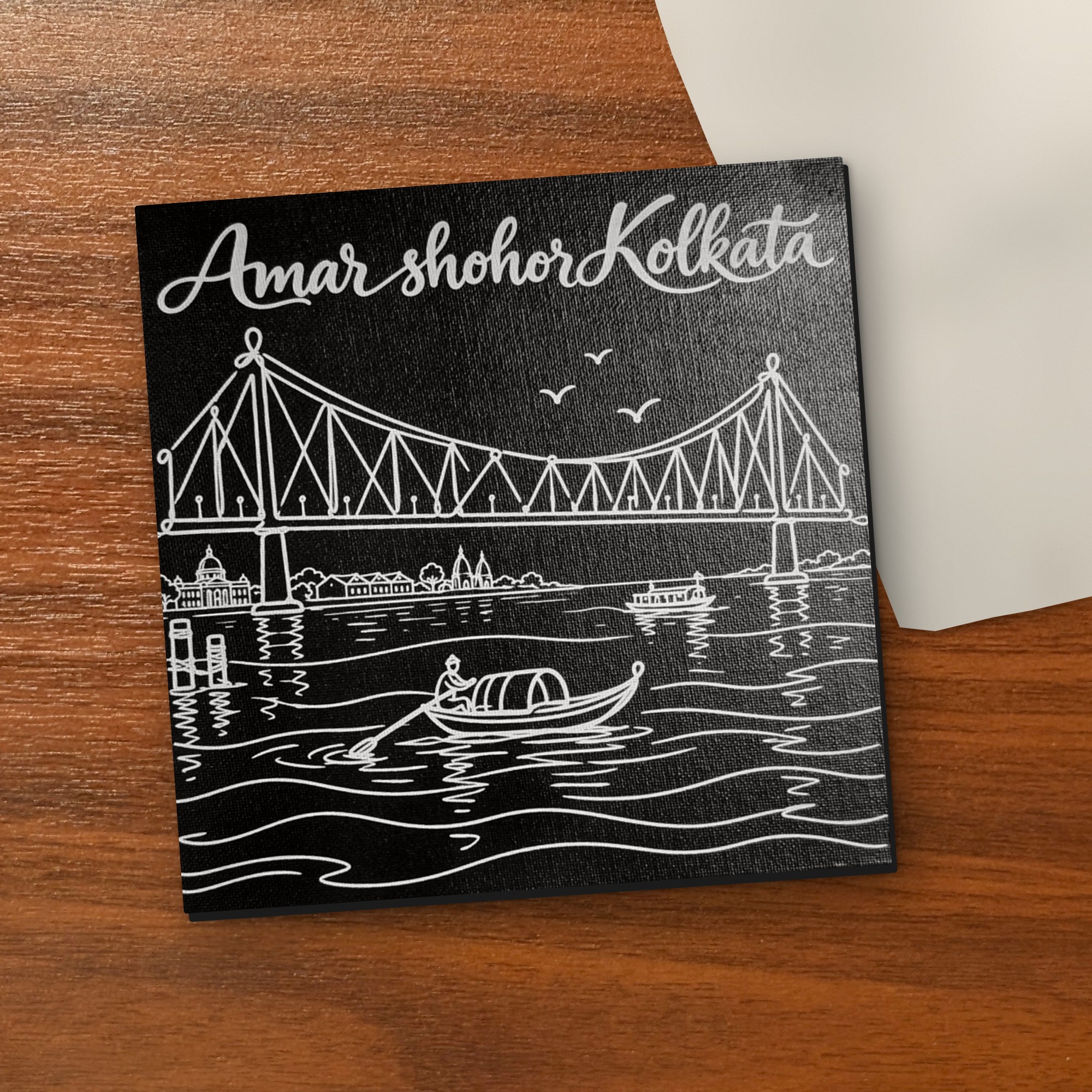 Amar Shohor Kolkata – Howrah Bridge 8x8 inch laser-engraved canvas on a wooden table