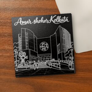Amar Shohor Kolkata - Nandan Edition 5x5 inch black engraved art canvas on a wooden table