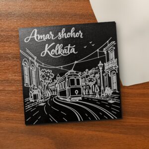Amar Shohor Kolkata - Tram Edition 5x5 inch black engraved art canvas on a wooden table