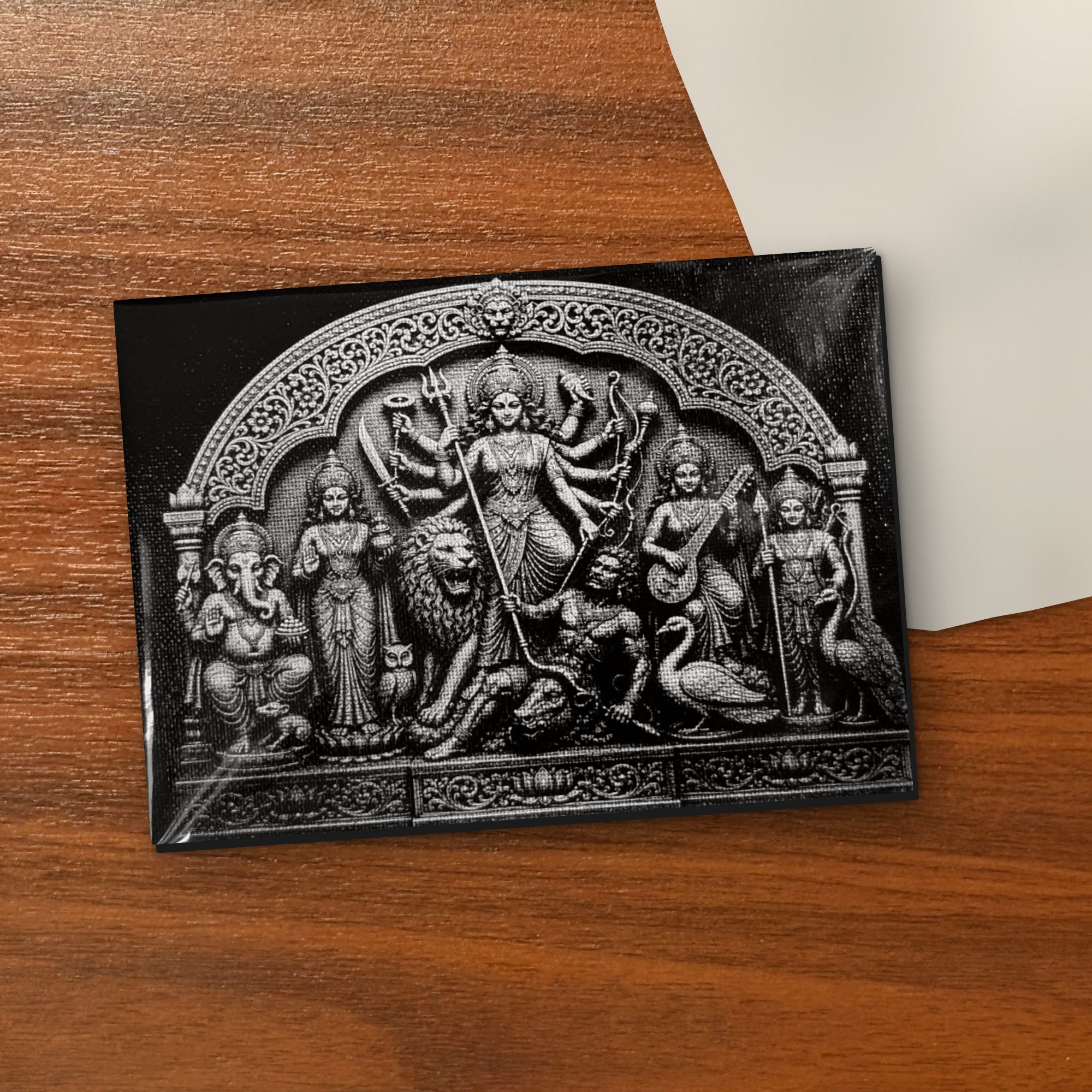 Ek Chala Durga black & white 5x7 inch laser-engraved canvas on a wooden table