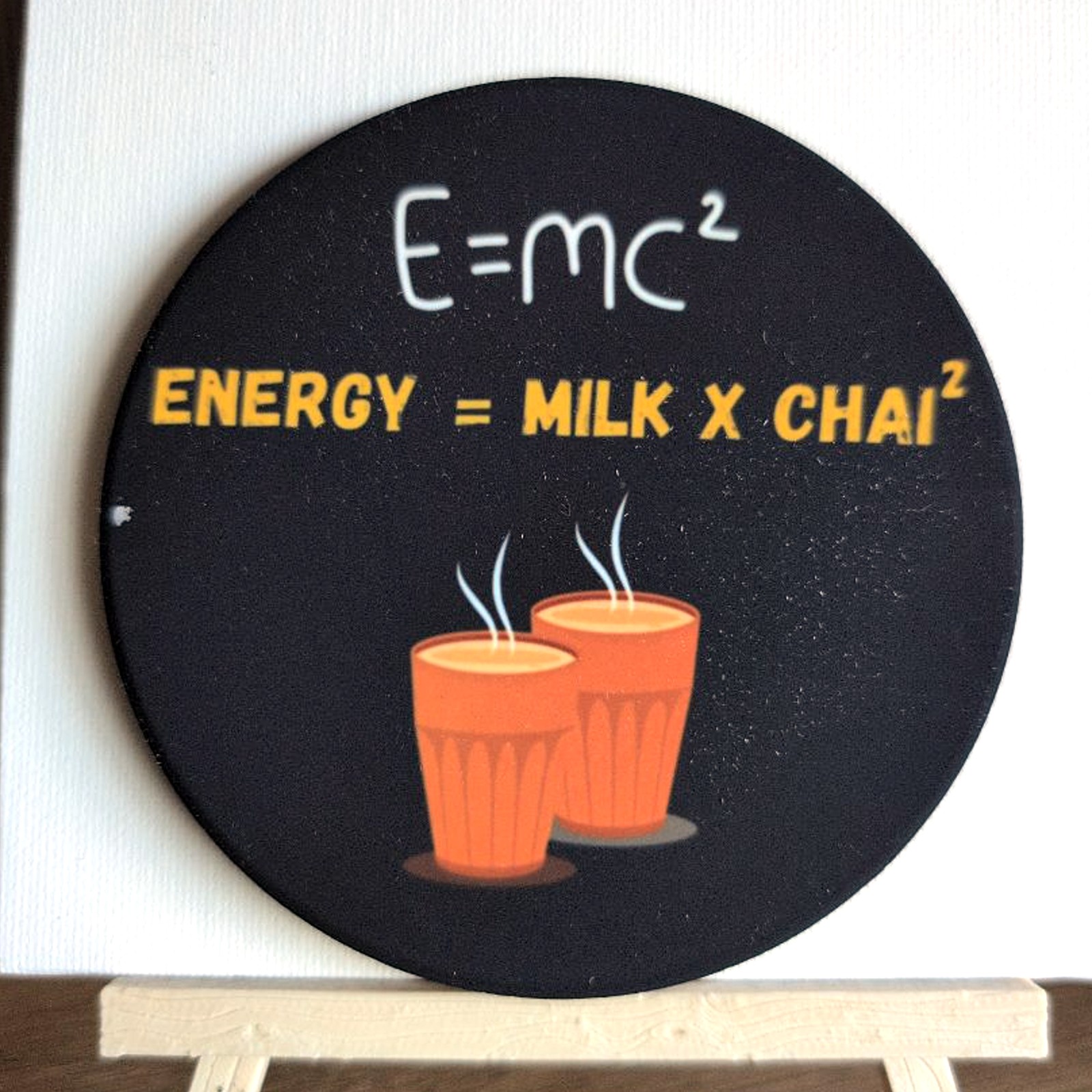 E=MC² (Energy = Milk × Chai²) ceramic coaster by Ayantika Sen, YldKat Studios