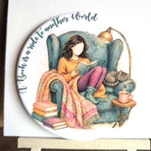 A Book Is a Ride to Another World ceramic coaster by Ayantika Sen, YldKat Studios